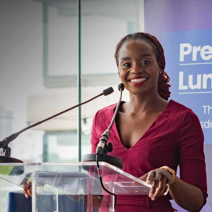 Ayo Sokale speaking on stage.